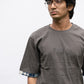 Grey oversized t-shirt with patchwork sleeves